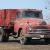 IH 1950 L160 Red truck with wood box and hoist