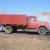 IH 1950 L160 Red truck with wood box and hoist