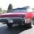1969 Convertible, red with black top and interior, bucket seats with console