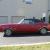 1969 Convertible, red with black top and interior, bucket seats with console